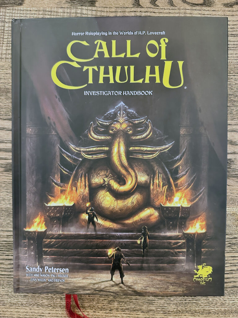 Cover of Call of Cthulhu 7th edition Investigator Handbook. It depicts a massive perhaps bronze satue of an elephant like god or goddess, looming over three investigators.