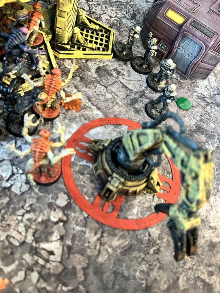 Bug Hunt co-op game in progress, with marines facing aliens in a colony outpost setting.
