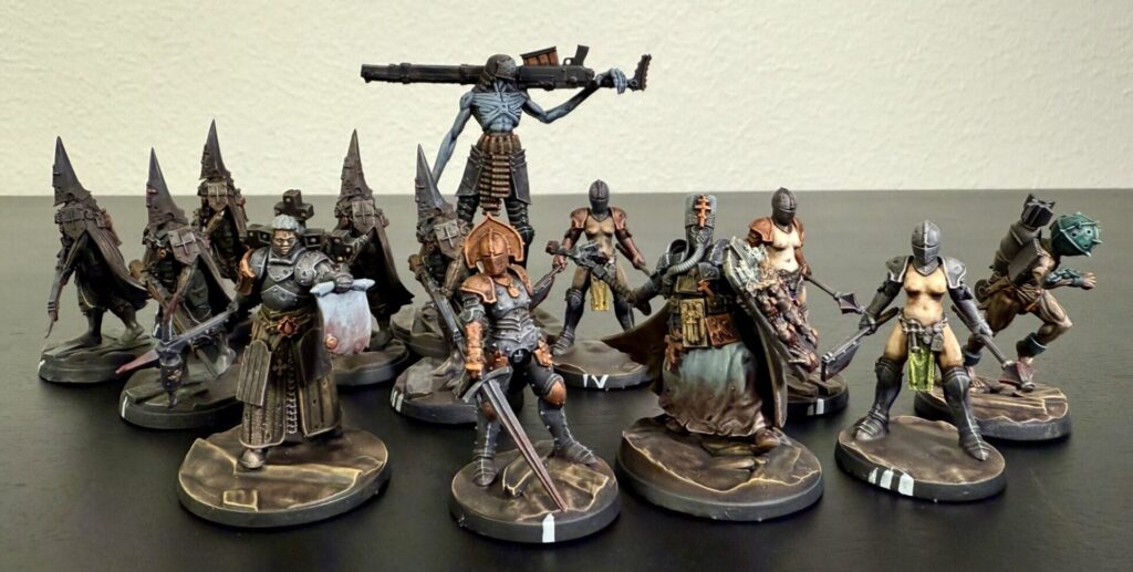 Trench Pilgrims warband, printed and painted by me. These are all official Trench Crusade miniatures. 13 in total. The three topless Stigmatic Nuns are copies of each other, as are the five Pilgrims with their sweet pointed helmets.